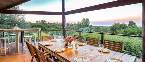 Start the day with coffee and birdsong, or wind down with a BBQ and sunset views over the bush and bay.