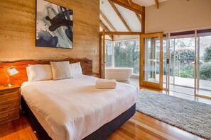 Sleep peacefully in the queen bed of the spacious primary suite, with walk-in robes and French doors that open onto the verandah with stunning bay views.