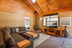 : Find a quiet moment in the separate living room with its own fireplace—perfect for films, reading, or giving different generations their own space.