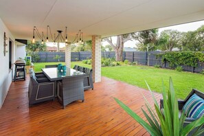 Fully fenced garden offers safe play for little ones and pets—just open the sliding doors and relax.