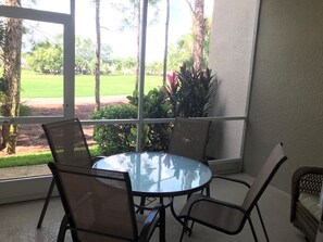 Lanai dining with comfortable lounge chair