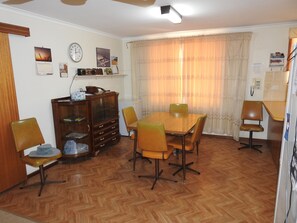 Dining table extends both ends. 6 more chairs in bedrooms or garage. TV moves.