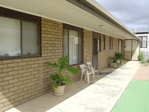 Side gate access to verandah is sheltered from prevailing southerly winds.