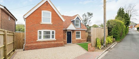 Front of house with parking for two cars