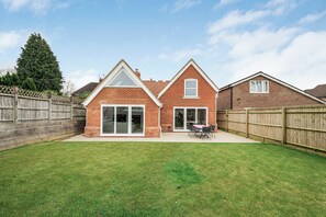 Rear elevation with view of garden and patio