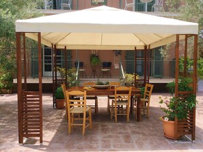 This comfy gazebo will let you spend a good time together with your friends ....