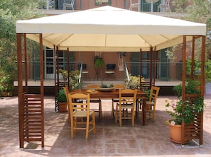 This comfy gazebo will let you spend a good time together with your friends ....