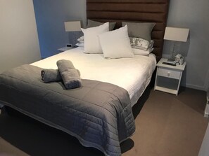 Master bedroom with en-suite bathroom, built-in wardrobes and smart TV with Netflix