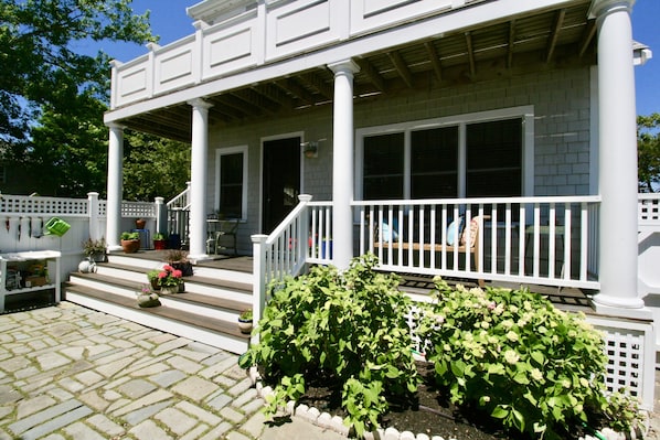 Inviting front porch with views of huge exclusive outdoor patio