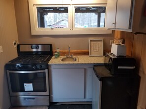 Kitchen upgraded with granite countertop, new sink and new appliances. 