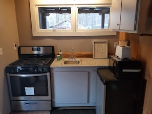 Kitchen upgraded with granite countertop, new sink and new appliances.
