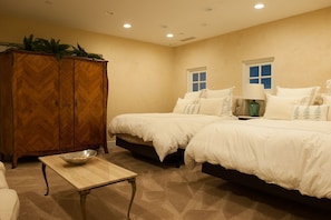 Fourth bedroom, located near front entry. Two queen size beds
