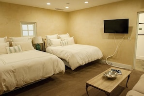 Fourth bedroom, located near front entry. Two queen size beds