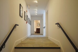 Interior hallway that leads up to the 3rd floor to the penthouses