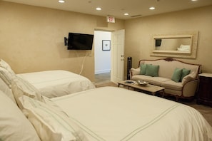 Fourth bedroom, located near front entry. Two queen size beds