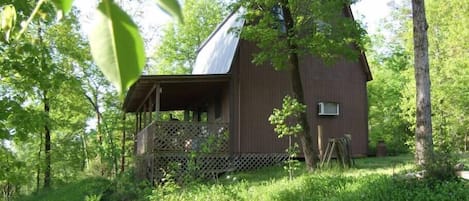 Enchanted cabin in forest on bluff overlooking recreation area on the Ouachita River