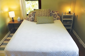 Queen size bed in private bedroom. (image 2)