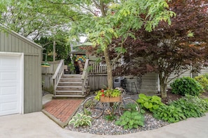 Stairs to the back deck and door to enter the house. 