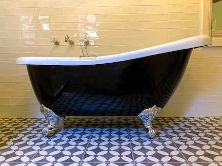 Relax in Inglenook's claw foot bathtub
