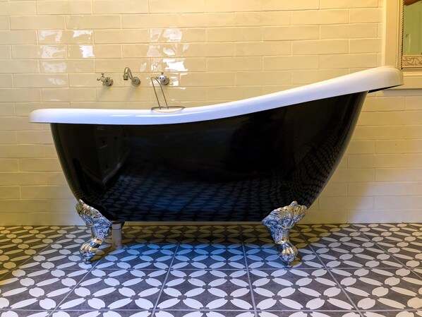 Relax in Inglenook's claw foot bathtub