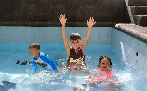 Enjoy basking in the sun while the kids splash around.