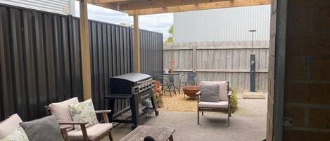 Great outdoor under cover area, with comfy outdoor setting and brand new BBQ
