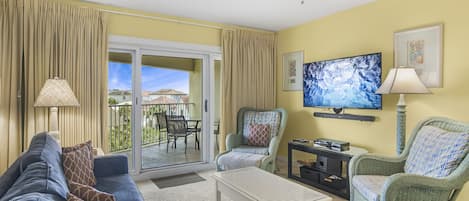 Living Room with Flat Screen TV and Balcony Access