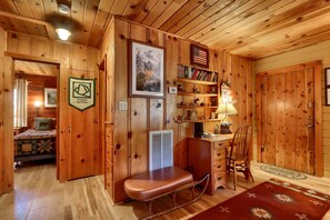 Entryway with all-new hardwood floors throughout the cabin