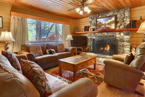 Living room with a beautiful rock fireplace