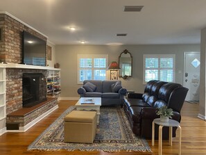 Super cozy living room.   Electric fireplace and reclining lazy boy sofa.