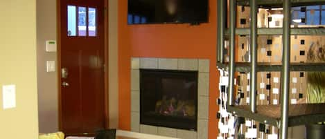 Living Room with cozy gas fireplace and 55" flatscreen TV