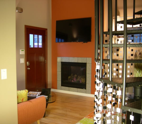 Living Room with cozy gas fireplace and 55" Smart TV