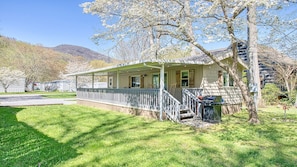 Enjoy the beautiful surroundings while rocking on the covered porch.