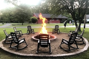 Huge fire pit in the backyard with the Red House in the front