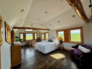 Enjoy breathtaking scenery and plenty of space to relax in the inviting master bedroom.