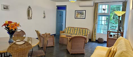Spacious air-conditioned living/dining room - Doors leading to bedroom & balcony