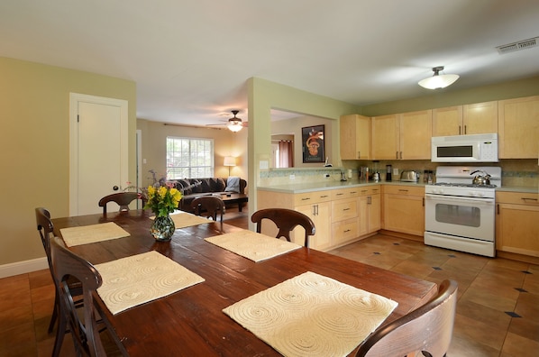 Architect designed, fully equipped kitchen invites dining and cooking in.