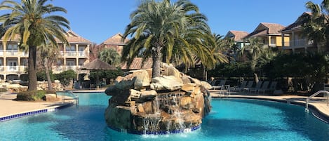 Swim/play/relax with an island waterfall in the middle of the massive pool!