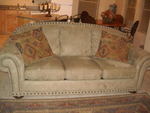 Full size bed pulls out of the couch...bedding provided.
