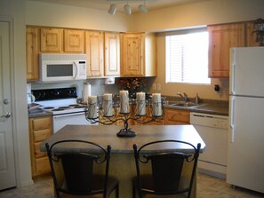 Knotty Alder cabinets, build in micro, great selection of dishes/cookware.