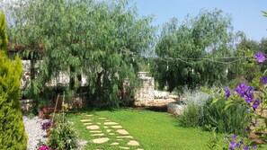 The entrance to the gazebo through the garden