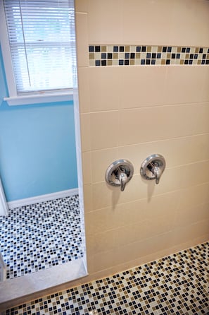 Huge custom walk-in shower for multiple users.