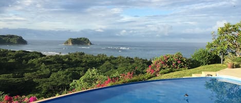 View of the ocean and jungle canopy from the patio of Villa Vista