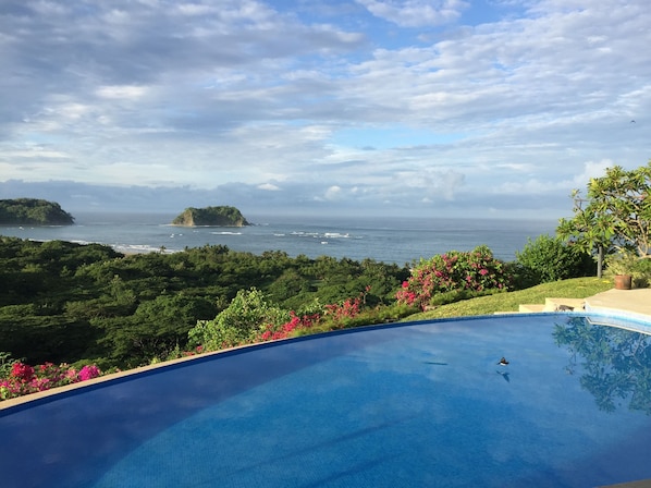 View of the ocean and jungle canopy from the patio of Villa Vista