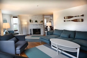 Large living room with TV and fireplace