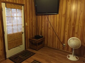 Rooms for sleeping have a television with direct TV and a fan for circulation.