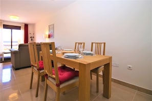 Modern dining area with seating for four guests