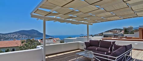 The Terrace upper private roof terrace with lounging furniture and pergola shade