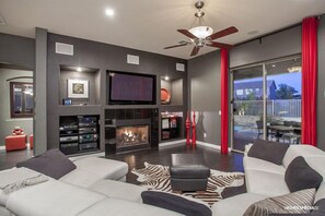 Family room with view to the backyard, patio and pool/spa area