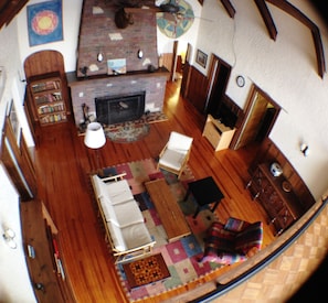 The loft looks out over the living room.